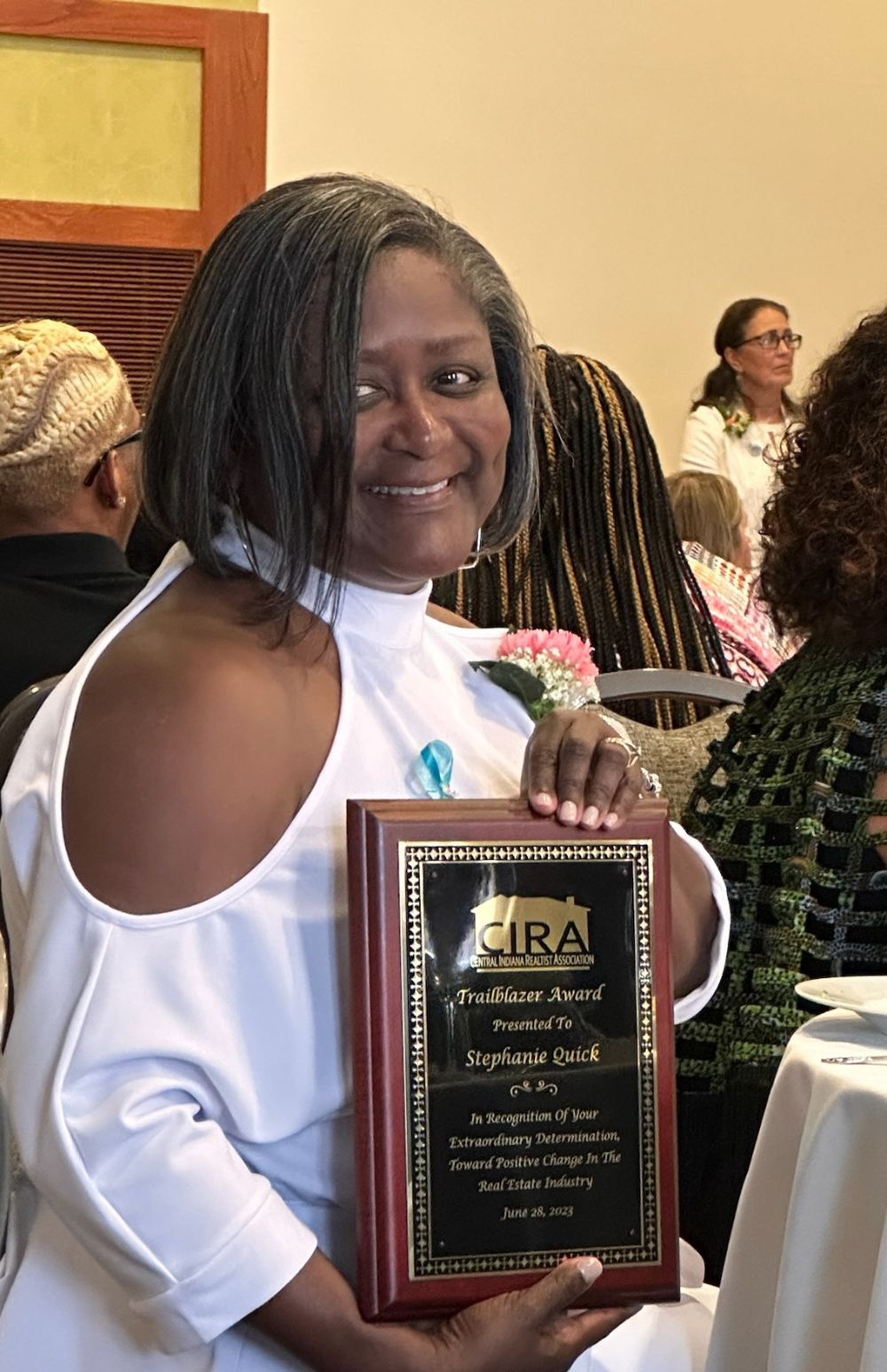 Stephanie posing for a picture with her CIRA Award.
