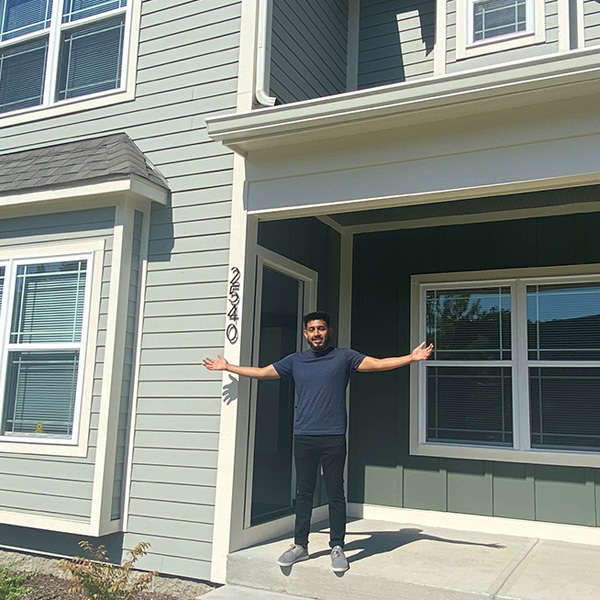 Fabio-Home Fabio standing outside his new home